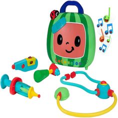 an assortment of toys including a green bag and musical instruments on a white background with clippings