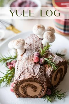 the yule log has mushrooms on top of it