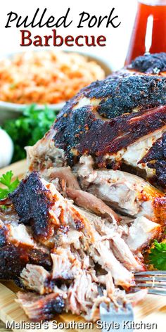 pulled pork barbecue on a cutting board with garnish