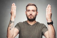 Young man raising his hands up, looking upset and serious. Disappointed and angry expression. His Hands, Tattoos, Quick Saves