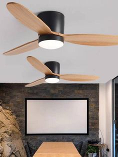 the ceiling fan is hanging from the ceiling in an office with wooden tables and chairs