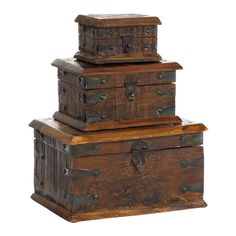 three wooden trunks stacked on top of each other