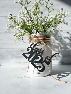 a mason jar with some flowers in it