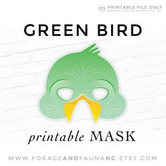 a green bird mask with the words printable mask