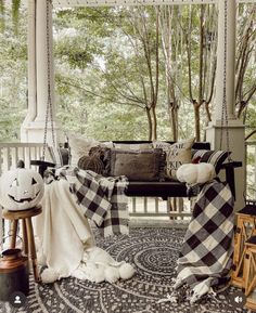 Black and white color scheme for this fall porch with a swing styled with buffalo check throw blankets, pillows and white pumpkins. Fall Porch Pillows Outdoor, Black White Porch, Black And White Front Porch, Buffalo Check Fall Decor, White Pumpkin Decor, White Porch, Fall Front Porch Ideas, Waynesville Nc, Black Bench