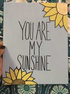 someone holding up a card that says you are my sunshine