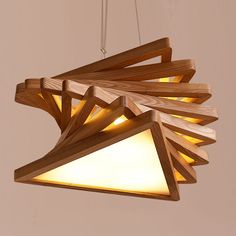 a wooden light fixture hanging from a ceiling