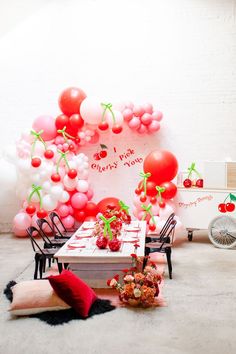 a room filled with balloons and decorations for valentine's day or any other holiday event