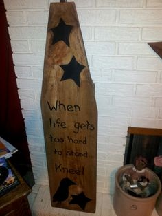 a wooden sign that says when life gets too hard to handle