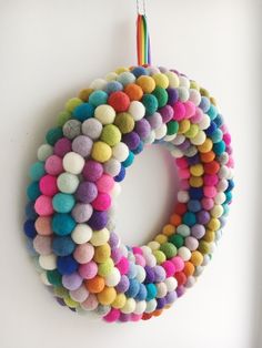 a multicolored wreath hanging on the wall