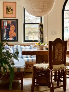 a living room filled with furniture and lots of windows