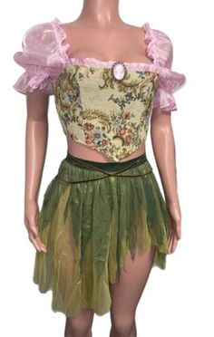 a mannequin wearing a green and pink skirt