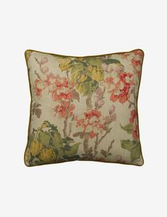 an embroidered pillow with flowers on it