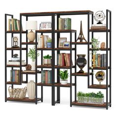 an open bookcase with many books and plants