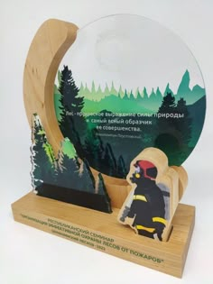 a wooden award with a fireman standing next to it