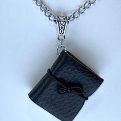 Super Cute. Perfect For The Book Lover, Teacher, Librarian, Writer, Author, Student, Travelerbrown Leather Cover With Actual Paper Pages. Stainless Steel Chain Measures 18”. Pendant Drop: 2.5”. Book Measures: 1.25”L X 1.1/8”W. Comes With Gift Bag. Makes A Unique Gift. Book Necklaces, God Jewelry, Black Leather Necklace, Teacher Librarian, Artisan Jewelry Handmade, Eyelash Yarn, Leather Bound Books, Book Jewelry, Handmade Jewelry Necklace