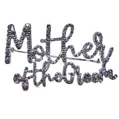 a brooch pin with the words make it sparkle