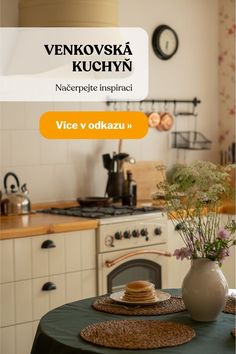 a table with plates and flowers on it in front of a kitchen stove top oven