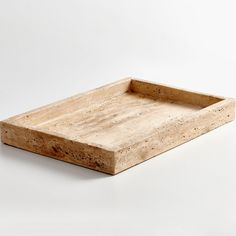 a wooden tray sitting on top of a white table