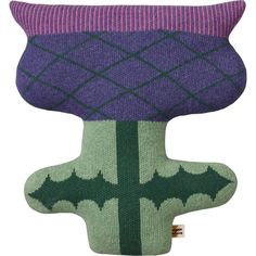 a purple and green knitted pillow with an upside down design on the bottom, sitting in front of a white background