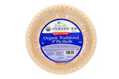 a plastic container filled with cheese on top of a white background and the words organic traditional gr