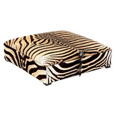 a zebra print seat cushion with black and white stripes on the front, sitting on a white background