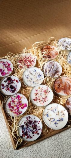 a box filled with lots of different types of soaps on top of a table