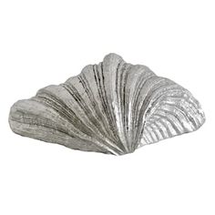 a silver seashell on a white background