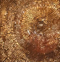 a close up view of a circular design made out of small bricks and wood blocks