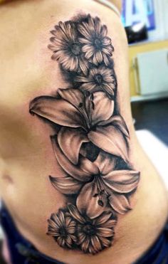 a woman's stomach with flowers on it