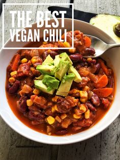 the best vegan chili in a bowl with avocado on top