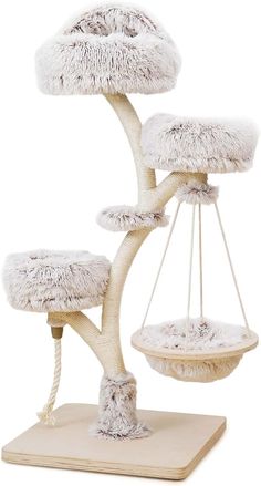 a cat tree with two hammocks on it