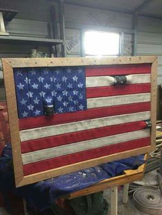 an american flag is displayed in a workshop