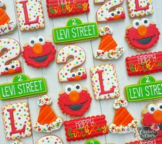 decorated cookies with numbers and sesame street characters