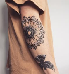 a person with a tattoo on their arm