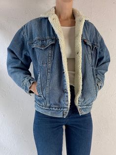 - Vintage 1980s Levis faux shearling lined denim jacket - Snaps up the front - Made in USA - Tagged L but fits womens XS Chest: 20.5" Length: 23" Sleeve: 19" Affordable Levi's Denim Blue Outerwear, Fleece Lined Denim Jacket Outfit, Cheap Levi's Long Sleeve Outerwear, Winter Denim Jacket With Faux Fur Lining, Retro Denim Blue Jacket For Winter, Retro Medium Wash Outerwear For Winter, Retro Medium Wash Winter Outerwear, Wool Jacket Outfit, Denim Jacket Women Outfit