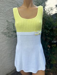 Here is a vintage 1970s Hampton Court knits Tennis Dress. Following are the measurements. Bust 34",Waist 30",Hips 42",Length measured from top of shoulder to hem 30". Bodice is yellow with white skirt.Cute bow. In nice vintage condition. Please take special consideration of measurements. 1970 sizing was much smaller than today's standards. Take extra special note of length. Tennis dresss were very short not like a regular dress.If you live overseas please email me first before purchasing for mai Womens Sports, Cute Bow, White Skirt, Tennis Dress, Vintage 1970s, Yellow Dress, Sports Women, Sport Fitness, Bodice