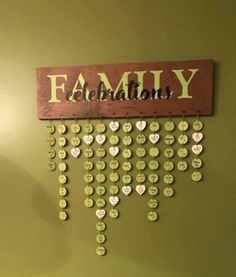 a wooden sign hanging on the side of a wall with lots of buttons attached to it