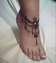 a woman's foot with a tattoo on it