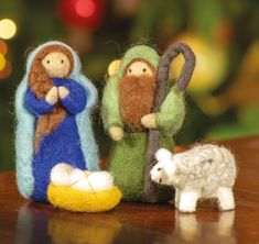 three felt nativity figurines on a table