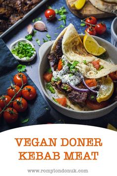 vegan doneer kebab meat in a bowl with tomatoes, onions and lemon wedges