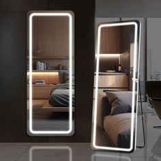 two mirrors that have lights on them in the shape of rectangles over a bed