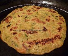 an omelet is cooking in a pan on the stove