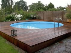 an above ground pool on a wooden deck