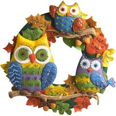 an owl wreath is shown with the words home & garden essentials $ 28 26