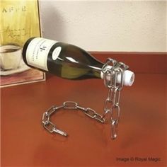 a wine bottle is chained to a metal chain