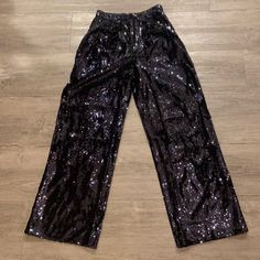 Gorgeous “Navy” Sequin Pants. A Must Have! They’re Absolutely Stunning. I Love Them, But Have To Reposh Because I Cannot Fit The Small. The Pants Were Only Worn Once To A Dinner Party. You Can Dress Them Up Or Dress Them Down. You Won’t Be Disappointed With These Wide-Leg Sequin Pants. They Have Front Pleats In The Waist And Pockets!!! Really Well Made And Beautiful. Originally $250.00. Questions? Leave A Comment Below! Sequin Pants, Pants Color, Dinner Party, Pant Jumpsuit, Must Haves, Sequin, Wide Leg, Pants For Women, I Love