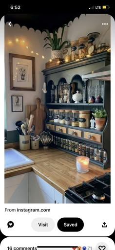 a kitchen filled with lots of pots and pans on top of a wooden counter