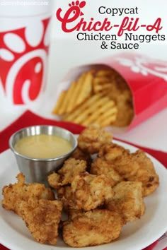 chicken nuggets and sauce on a white plate