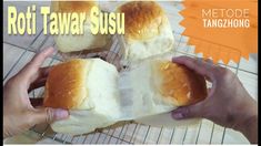 two hands holding rolls on top of a cooling rack with the words roti tawar susu